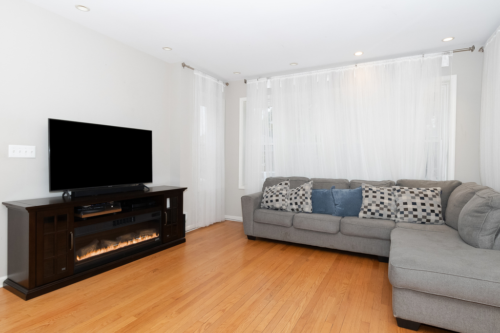 1234 Maple Avenue Berwyn, IL 60402 - Photo 3 of 25 a living room with furniture and a flat screen tv