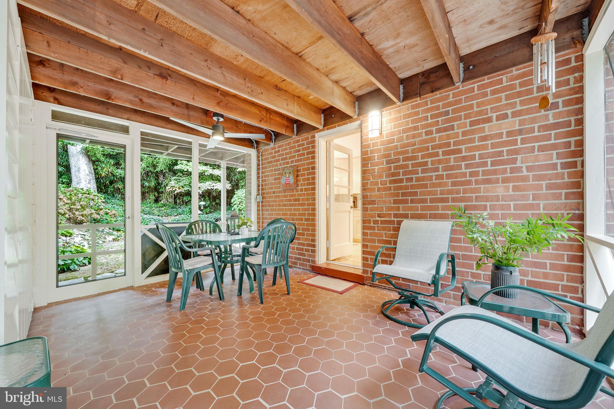 207 Buxton Road Falls Church, VA 22046 - Photo 12 of 42 Screen porch with ceiling fan off the kitchen