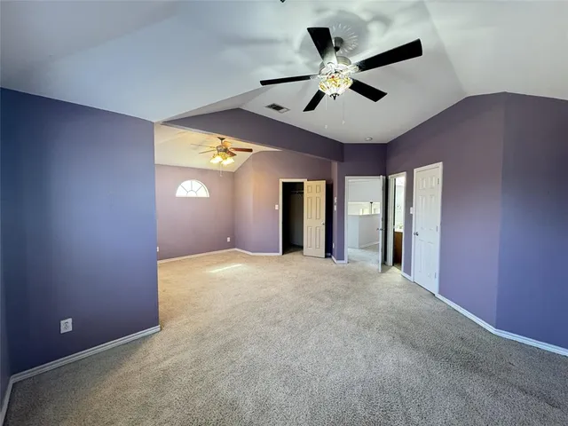 a kitchen with granite countertop a sink and a black white cabinets