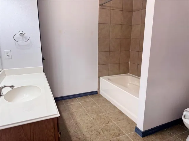 a bathroom with a bath tub