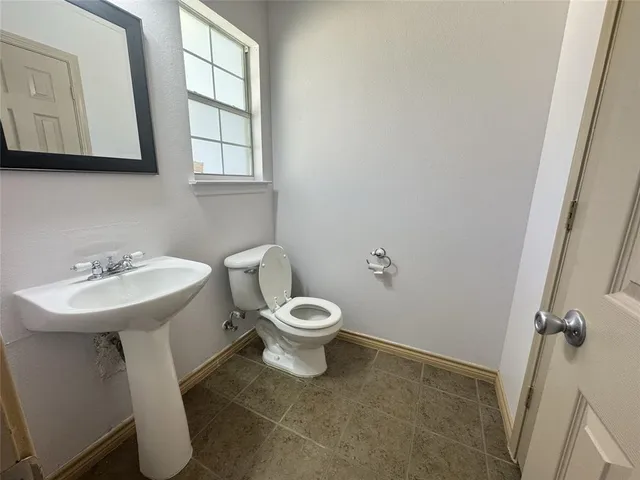 a view of entryway and hall with a sink