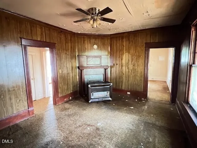 a kitchen with a stove a refrigerator and cabinets