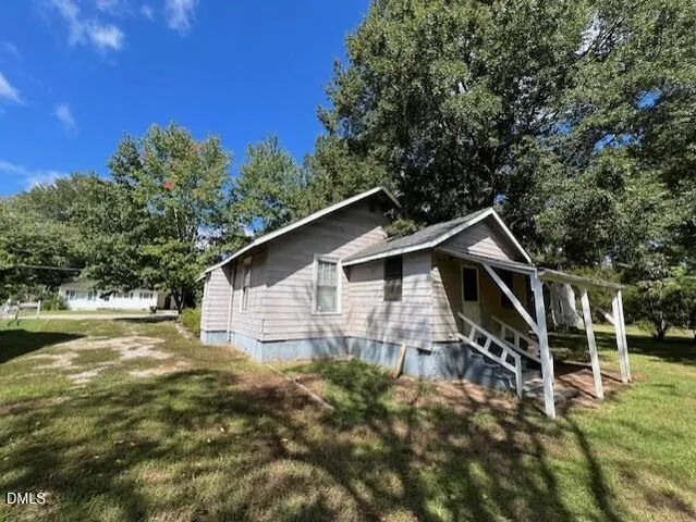 a backyard of a house with lots of green space