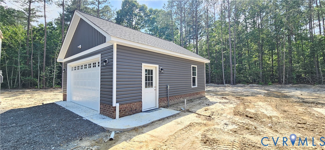 2982 Ashdale Road Center Cross, VA 22437 - Photo 6 of 17 Detached garage featuring gray horizontal siding,
