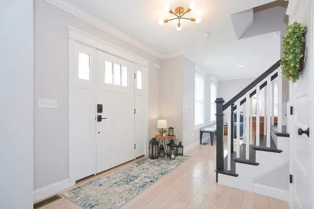 a very nice looking room with wooden floor and stairs