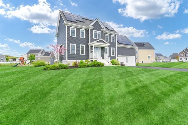 a front view of a house with a yard