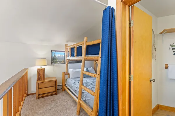 a bedroom with furniture and a window