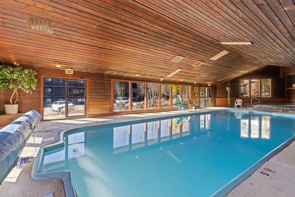 a view of a swimming pool with outdoor seating