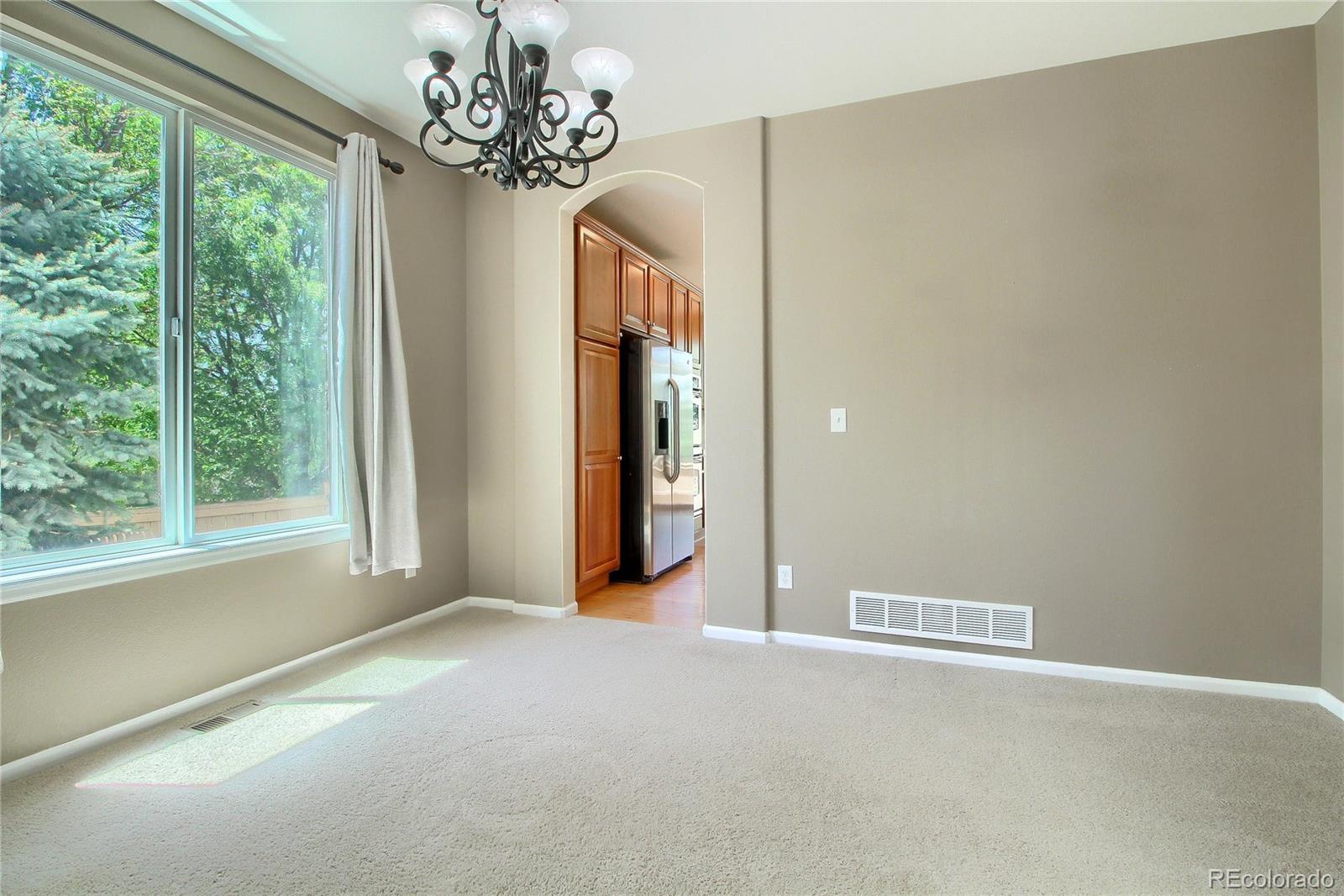 2705 Middlebury Drive Highlands Ranch, CO 80126 - Photo 12 of 40 a view of a livingroom with a chandelier