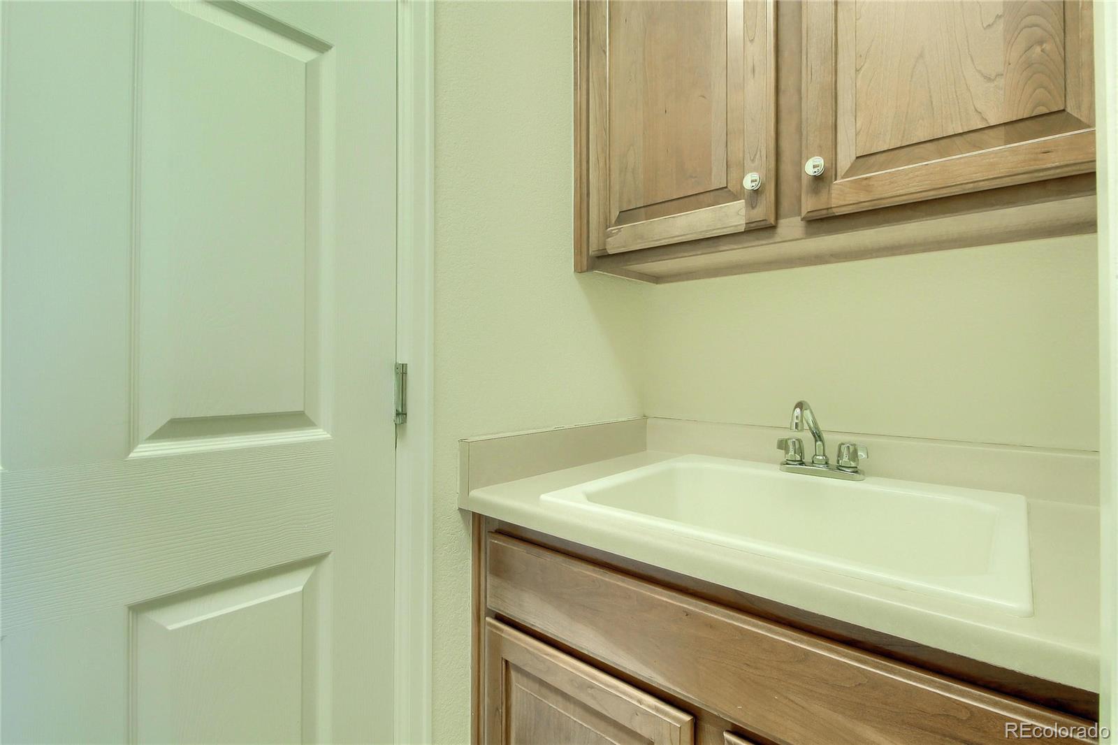 2705 Middlebury Drive Highlands Ranch, CO 80126 - Photo 18 of 40 a bathroom with a sink and vanity