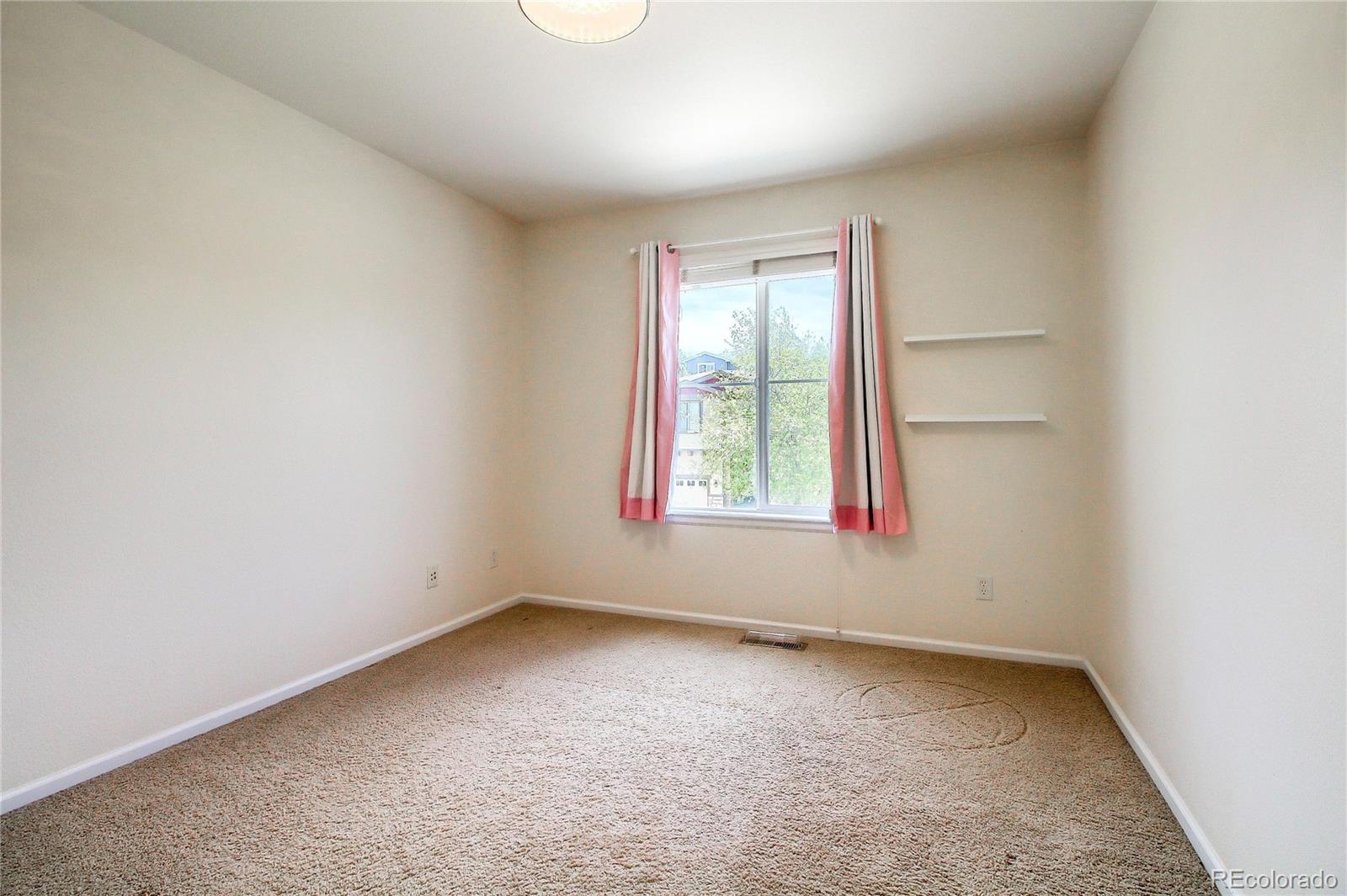 2705 Middlebury Drive Highlands Ranch, CO 80126 - Photo 23 of 40 an empty room with windows