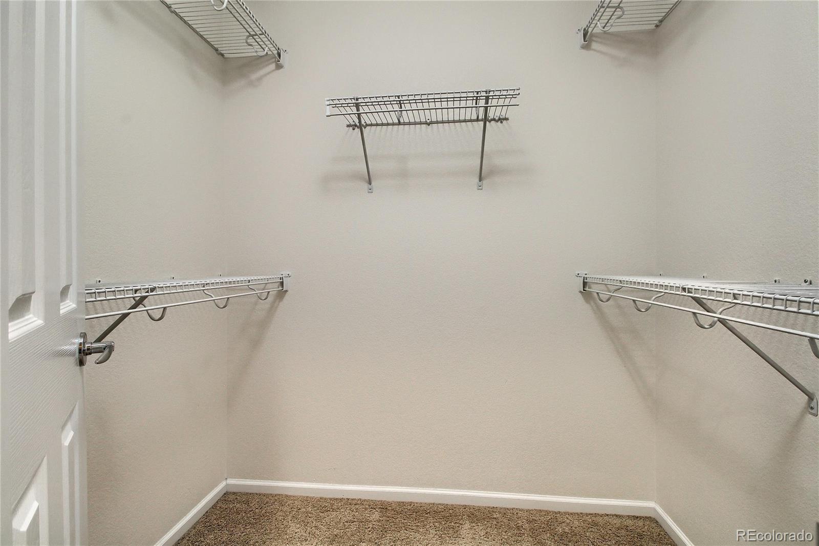 2705 Middlebury Drive Highlands Ranch, CO 80126 - Photo 31 of 40 a view of a room with racks on the wall