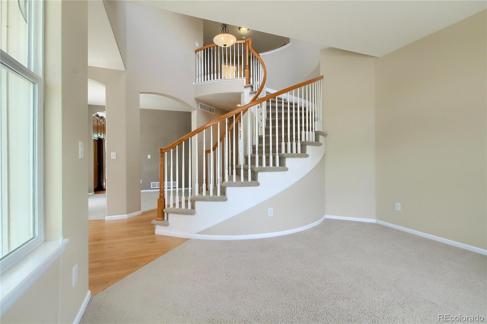 2705 Middlebury Drive Highlands Ranch, CO 80126 - Photo 10 of 40 a view of entryway and hall with wooden floor
