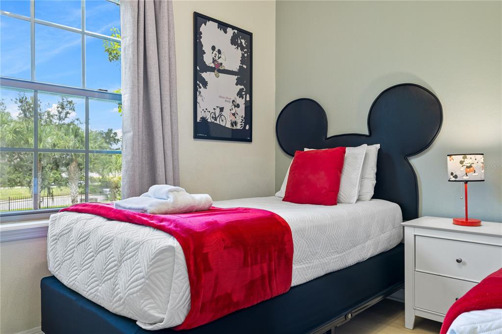 1905 Majorca Drive Kissimmee, FL 34747 - Photo 14 of 59 a bedroom with a bed and window