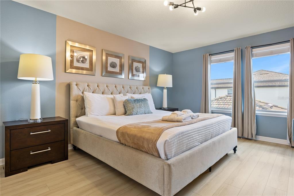 1905 Majorca Drive Kissimmee, FL 34747 - Photo 21 of 59 a bedroom with a bed and a night stand