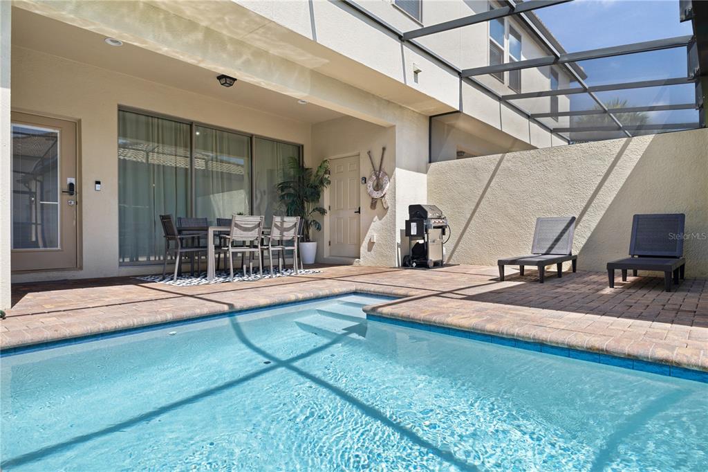 1905 Majorca Drive Kissimmee, FL 34747 - Photo 27 of 59 a view of a backyard with table and chairs