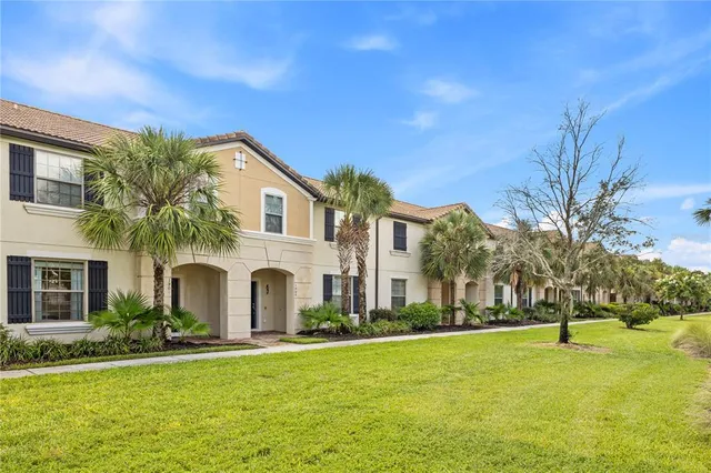 a kitchen with stainless steel appliances granite countertop a sink and a refrigerator