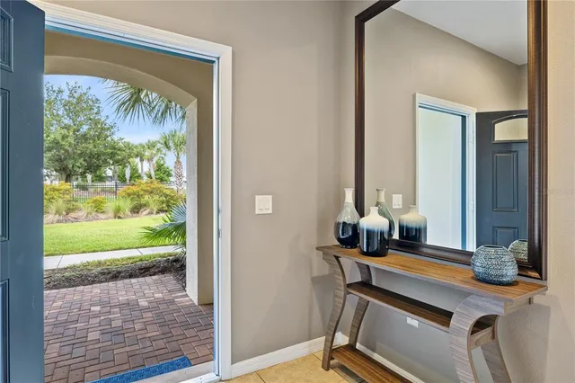 a kitchen with stainless steel appliances granite countertop a stove top oven a refrigerator a sink and a oven