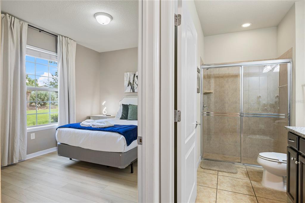 1905 Majorca Drive Kissimmee, FL 34747 - Photo 35 of 59 a spacious bedroom with a bed and a window