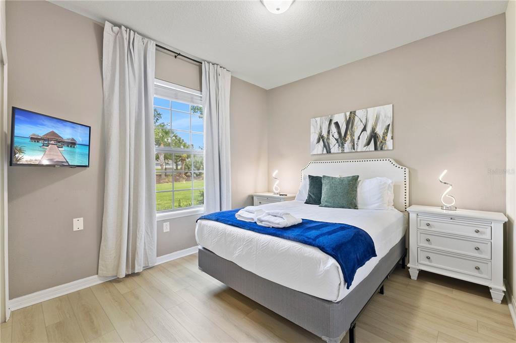 1905 Majorca Drive Kissimmee, FL 34747 - Photo 36 of 59 a bedroom with a bed and a window