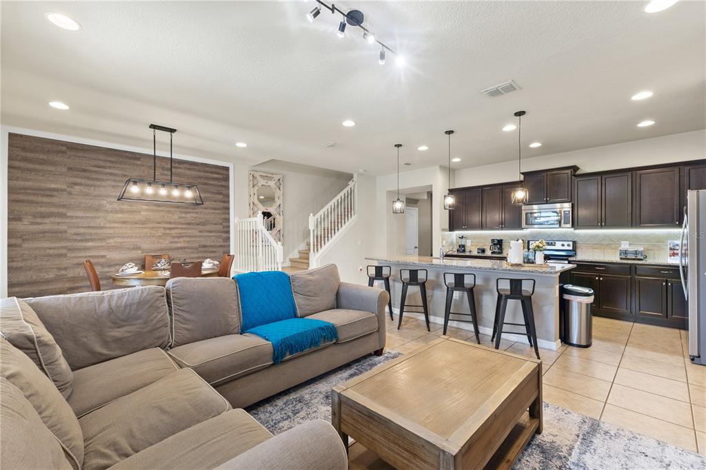 1905 Majorca Drive Kissimmee, FL 34747 - Photo 45 of 59 a living room kitchen with a couch and a view of kitchen
