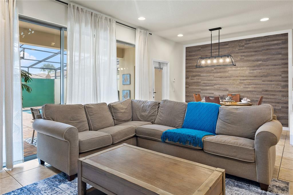 1905 Majorca Drive Kissimmee, FL 34747 - Photo 46 of 59 a living room with furniture wooden floor and a large window