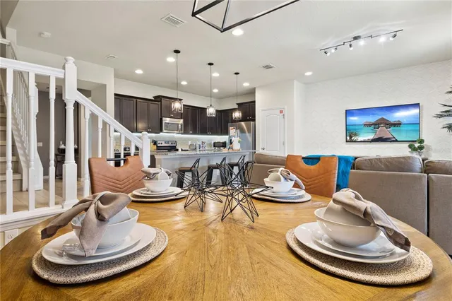 a living room with furniture and a table