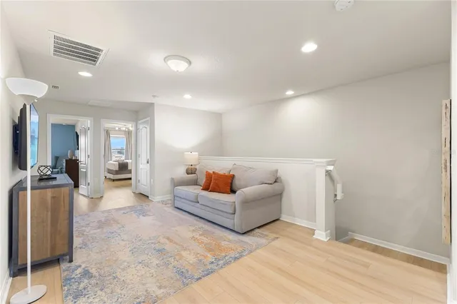 a view of a room with a table and chairs