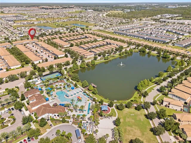 an aerial view of residential houses with outdoor space