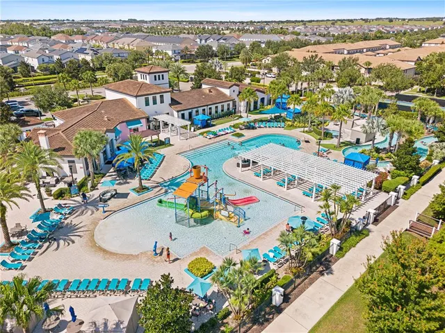 an aerial view of lake residential house with outdoor space and trees