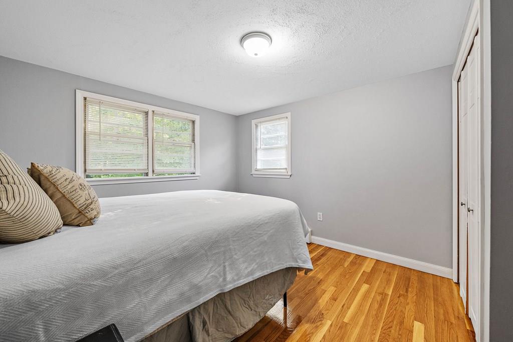 1075 Glebe Street Taunton, MA 02780 - Photo 11 of 31 a bedroom with a bed and a window