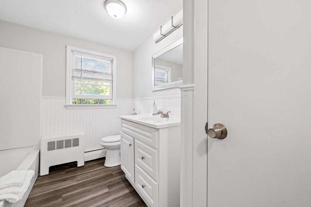 1075 Glebe Street Taunton, MA 02780 - Photo 15 of 31 a bathroom with a sink and mirror with toilet
