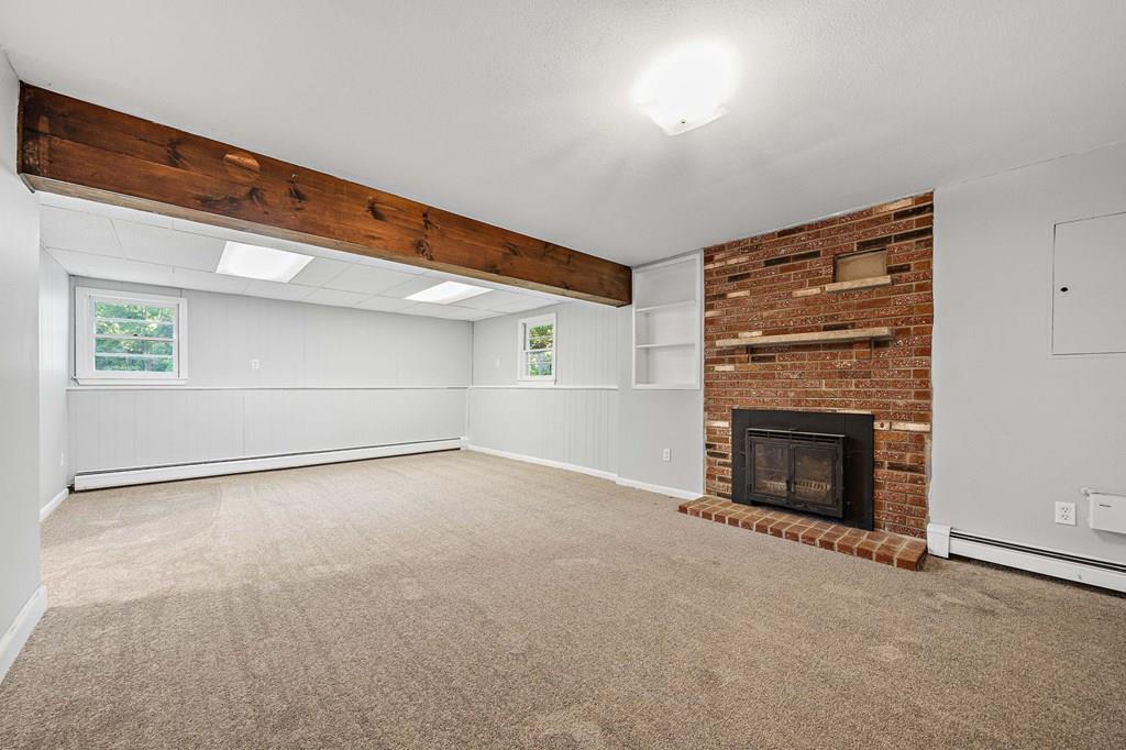 1075 Glebe Street Taunton, MA 02780 - Photo 16 of 31 an empty room with windows and fireplace