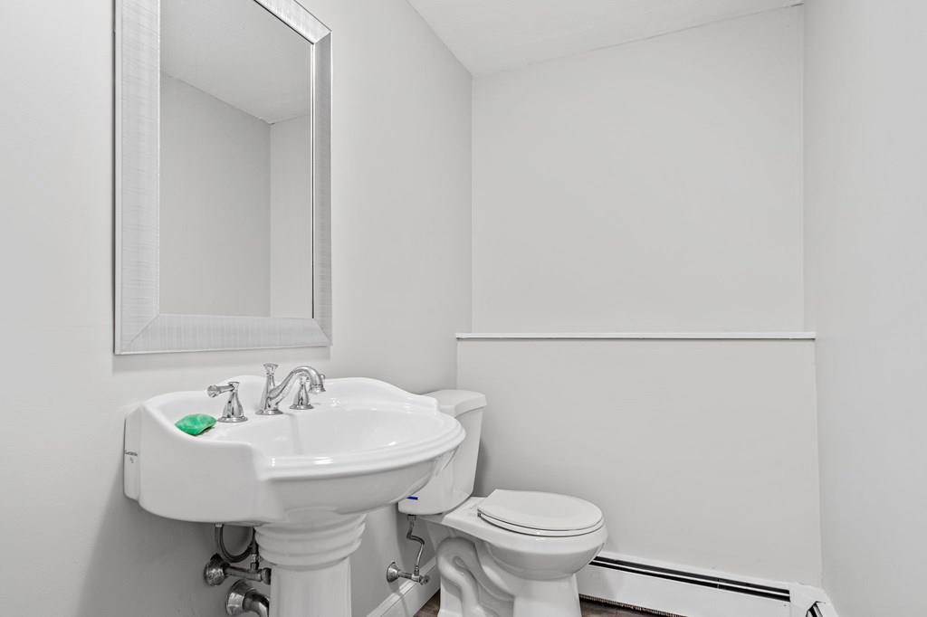 1075 Glebe Street Taunton, MA 02780 - Photo 19 of 31 a bathroom with a sink and a toilet
