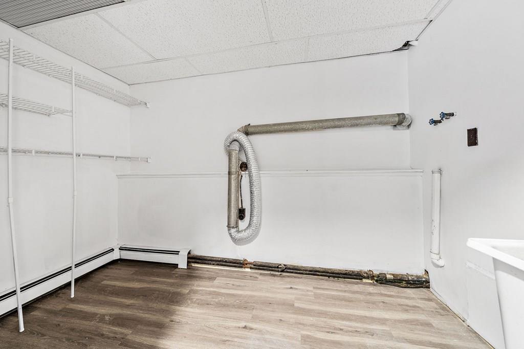 1075 Glebe Street Taunton, MA 02780 - Photo 21 of 31 a view of an empty room with wooden floor and a window