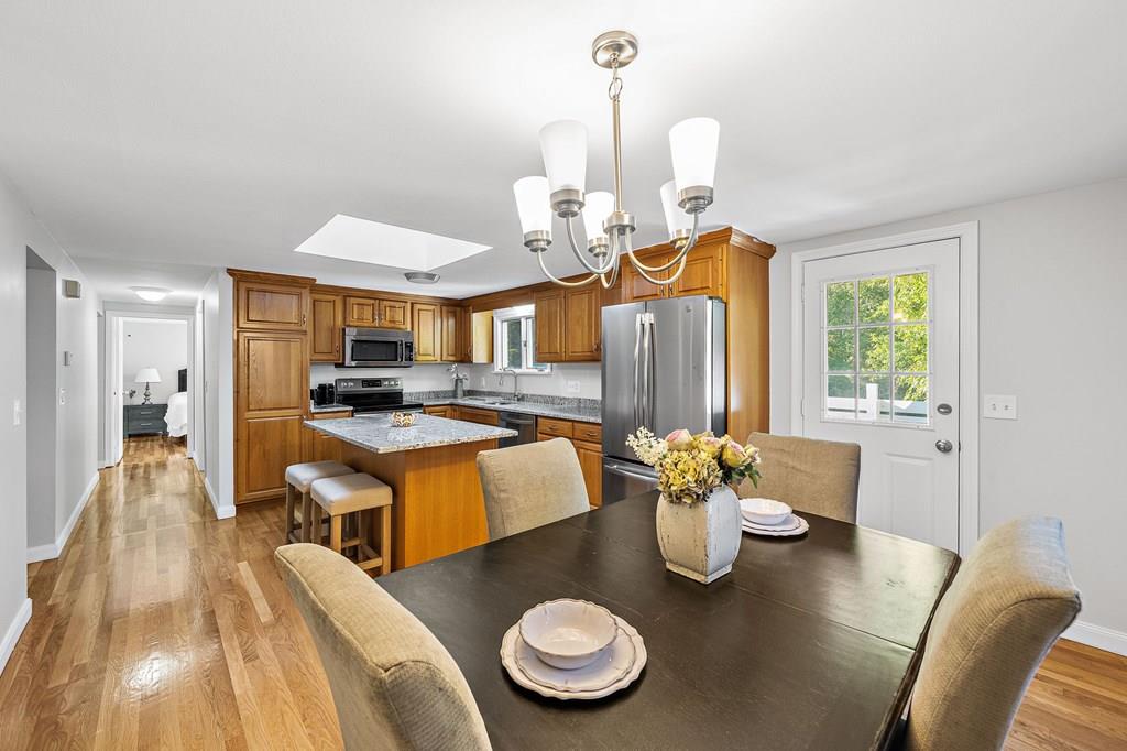 1075 Glebe Street Taunton, MA 02780 - Photo 3 of 31 a living room with furniture and a chandelier