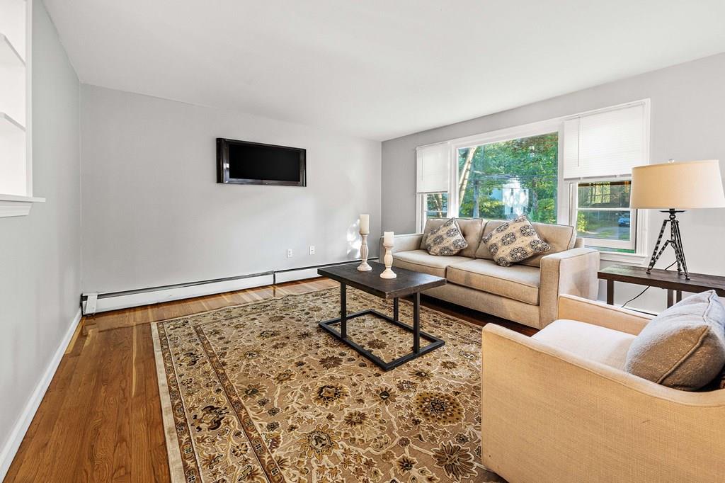 1075 Glebe Street Taunton, MA 02780 - Photo 7 of 31 a living room with furniture and a flat screen tv