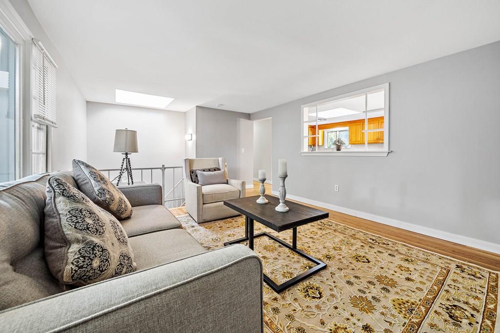 1075 Glebe Street Taunton, MA 02780 - Photo 8 of 31 a living room with furniture and a rug