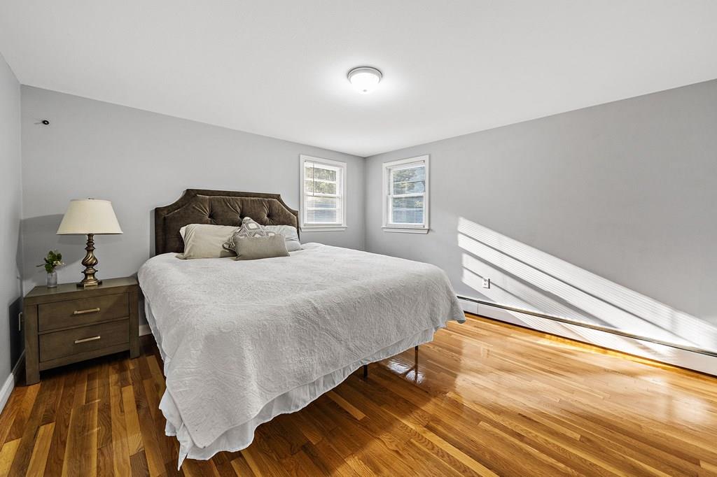 1075 Glebe Street Taunton, MA 02780 - Photo 9 of 31 a bedroom with a bed and a night stand