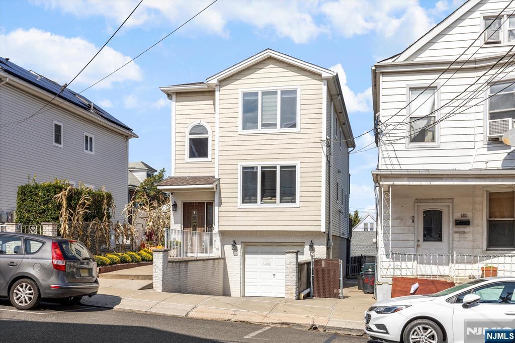 a view of a car parked in front of a house