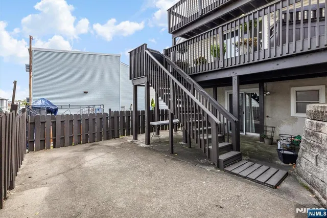 a view of entryway with wooden stairs