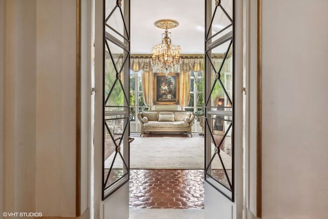a view of a livingroom with furniture and a window