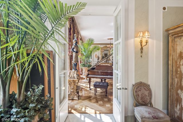 a large kitchen with stainless steel appliances granite countertop a stove and cabinets