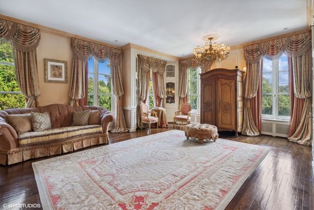 a view of a chair and table in the garden