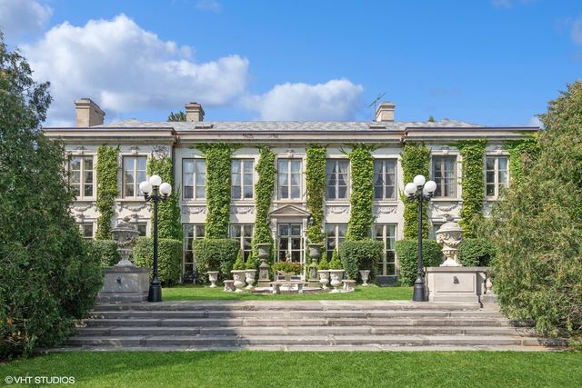 a view of a building with a yard