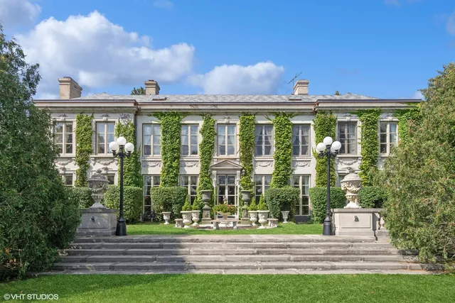 a view of a building with a yard