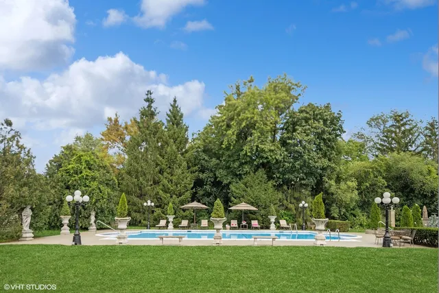 a view of a patio with table and chairs potted plants