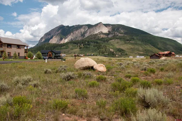a view of a town with mountains