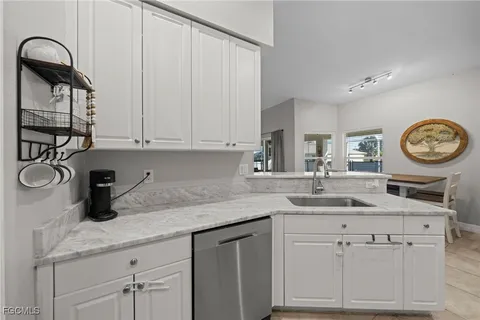 a kitchen with a sink and cabinets