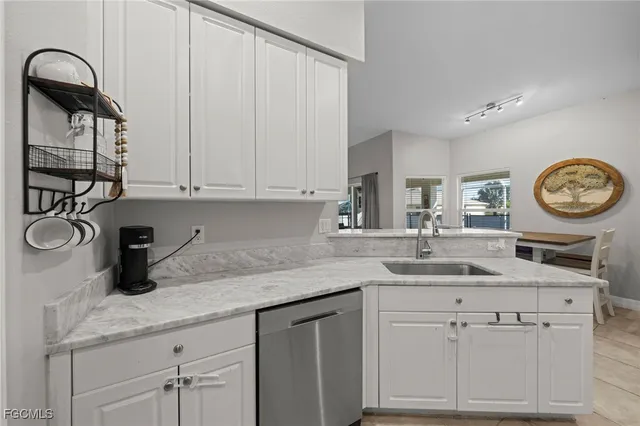 a kitchen with a sink and cabinets